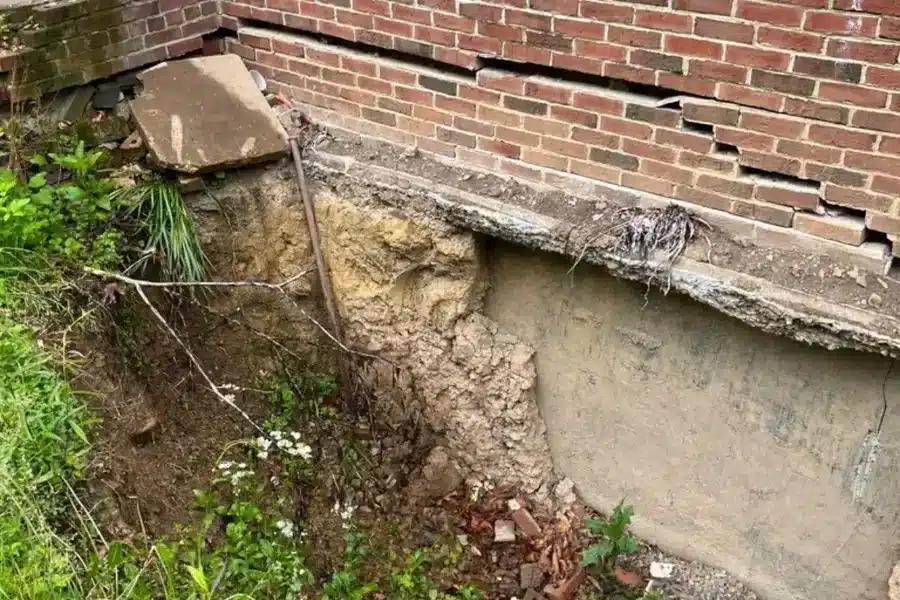 Caption 2 Expansive clay soil causing foundation heave at construction site during geotechnical investigation of soil swell potential.