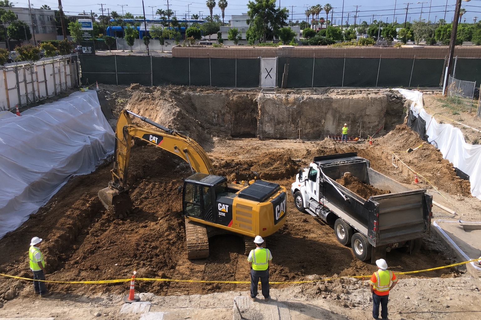 Caption 2 Remedial excavation in Los Angeles removes contaminated soil from a commercial construction site using excavators, dump trucks, and environmental safety controls to prepare the property for safe redevelopment.